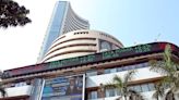 Nifty, Sensex gain marginally in a volatile session; Auto, FMCG stocks hold firm