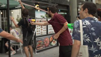 Protestors Spray Tourists with Water Guns During Demonstration Against Overtourism in Barcelona