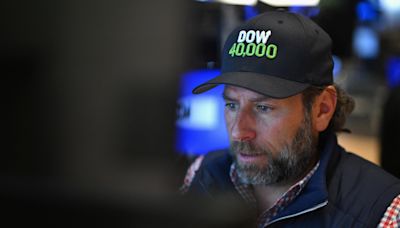 Dow closes above 40,000 for first time, notching new milestone