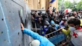 Violent protests outside Georgian parliament as ‘foreign agents bill’ approved