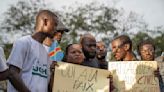 Families of the victims of attacks on displaced people in Congo mourn their dead