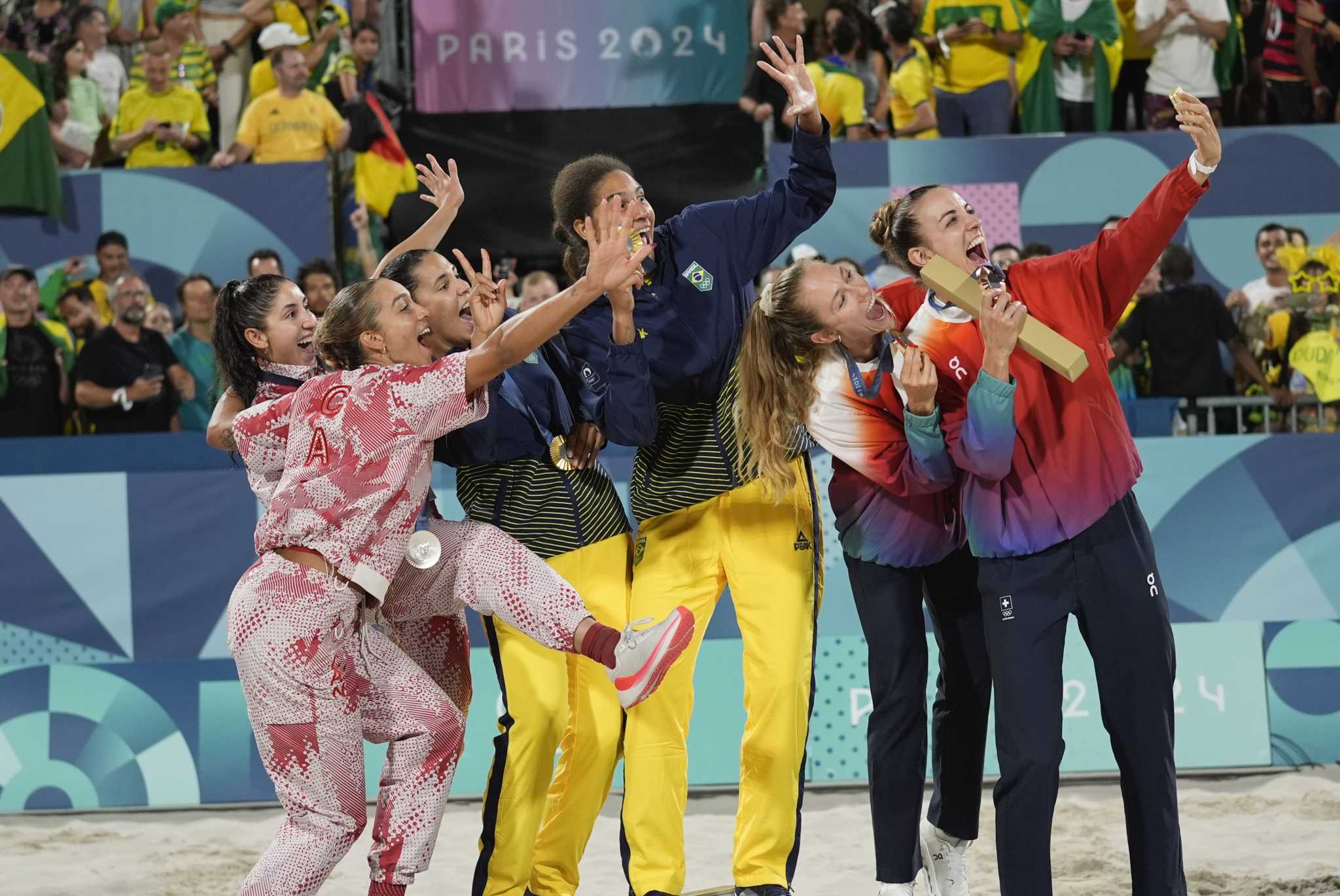 Brazil beats Canada in tense three-set women's beach volleyball gold medal match. Swiss win bronze