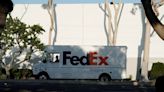 FedEx tumbles after sober results, broader market slips