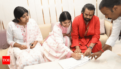 Tirupati laddu row: Pawan Kalyan visits Tirumala temple with daughter to offer prayers, signs 'declaration of faith' | Vijayawada News - Times of India