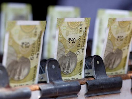 Rupee ends at record closing low, likely RBI intervention helps cap losses