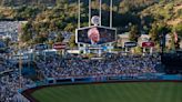 Scully honored with video tribute, banner at Dodger Stadium