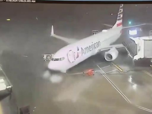 WATCH: Strong winds push American Airlines plane away from gate at DFW Airport