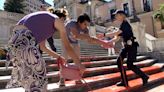 Activists pour paint down Rome’s Spanish Steps in outrage over femicide in Italy