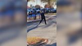 Hickory school officer cheers for football team as they head off to game