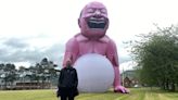 Giant pink man causes stir in small Welsh town