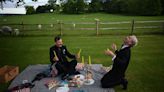 Music lovers enjoy opera and picnics with the sheep at Glyndebourne