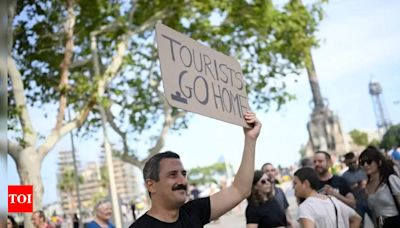 'Barcelona is not for sale': Mass anti-tourism protests erupt as living costs go into a tailspin - Times of India