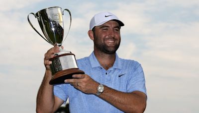 After protesters interrupt final hole, Scottie Scheffler defeats Tom Kim in playoff to win Travelers Championship