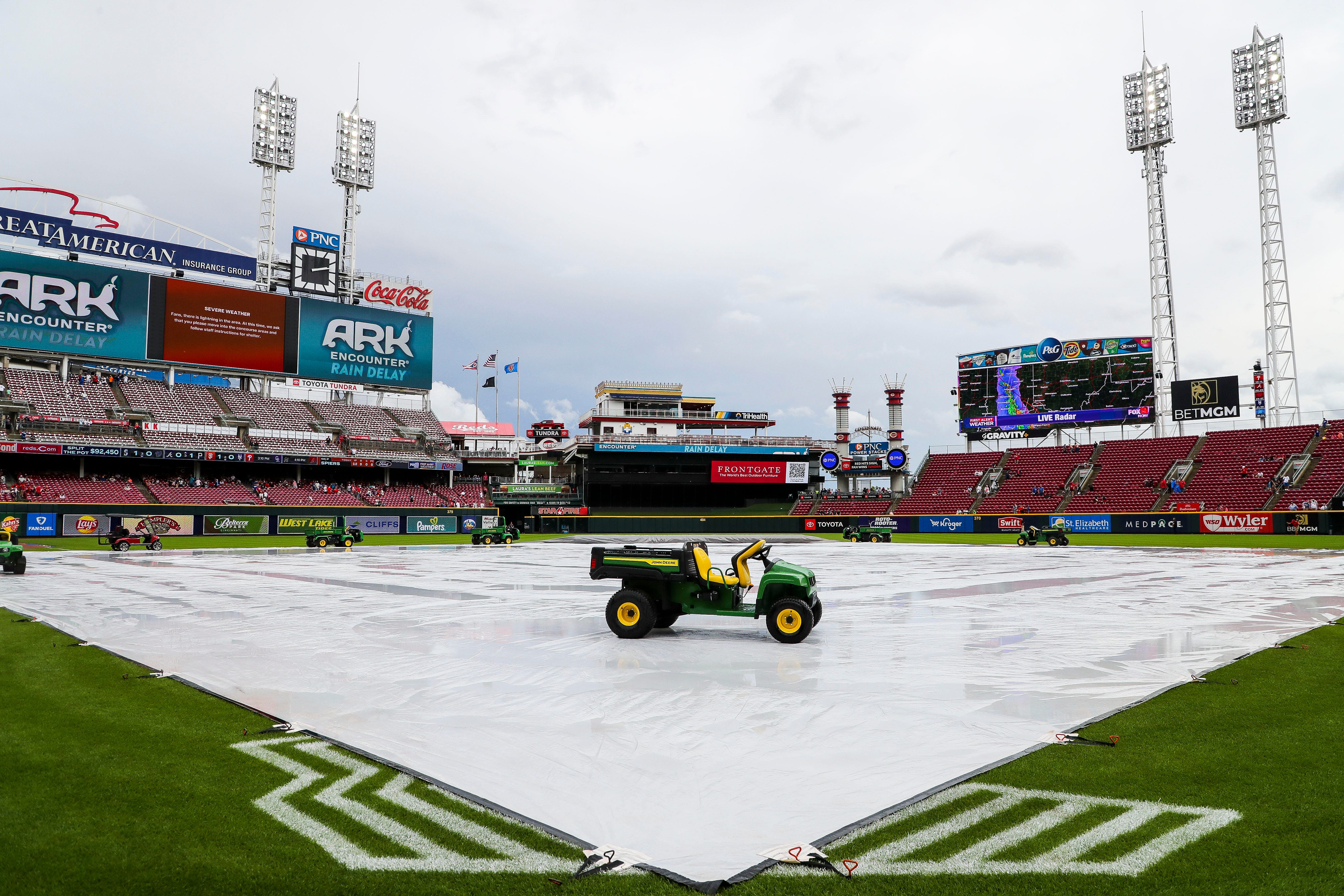 Watch: Cincinnati Reds' grounds crew member rescued from GABP 'tarp monster'