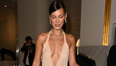 Bella Hadid commands attention in a plunging nude midi dress