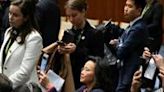 Australian journalist Cheng Lei (C) attends a signing ceremony by China's Premier Li Qiang and Australia's Prime Minister Anthony Albanese