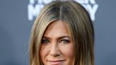 Jennifer Aniston Strips Down To A Robe With Her Natural Curls On Display As Fans React: ‘Stunning’