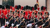 British, French troops march in historic joint parades in London and Paris in a show of solidarity