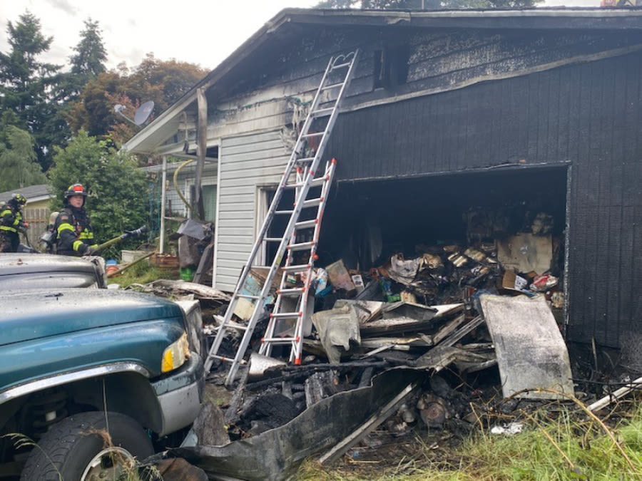 Crews cut holes in roof to fight house fire in Vancouver Saturday afternoon