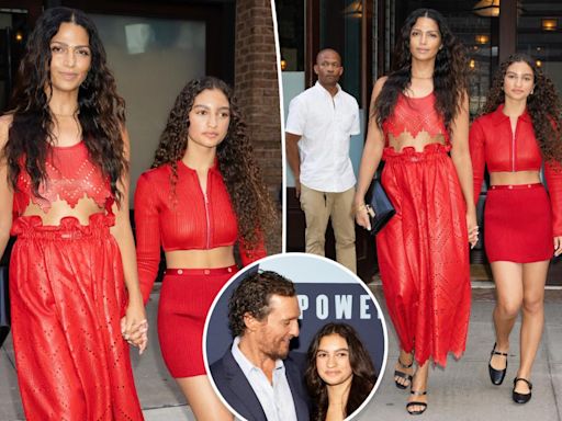 Matthew McConaughey’s wife Camila Alves and daughter Vida, 14, twin in red