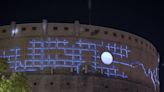 What does it mean? Bright blue art engulfs concrete tower behind a Sacramento Safeway