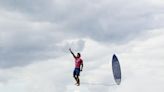 'Like he's walking on the cloud': The story behind the viral surfing photo from Paris Olympics