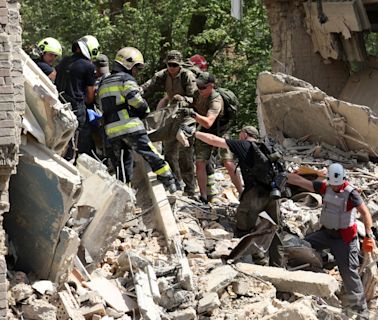 Live view of Kyiv children’s hospital as rescuers search for survivors after Russian missile attack