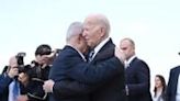 Israel Prime Minister Benjamin Netanyahu hugs US President Joe Biden upon his arrival at Tel Aviv's Ben Gurion airport on October 18, 2023