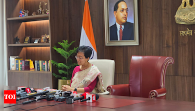 Atishi takes charge as Delhi CM, places empty chair for Arvind Kejriwal | India News - Times of India