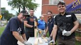 Knights of Columbus volunteers build beds for needy children in Windsor and Quebec