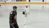 Skating Cameraman Camouflaged in White Captures Ice Hockey Fight