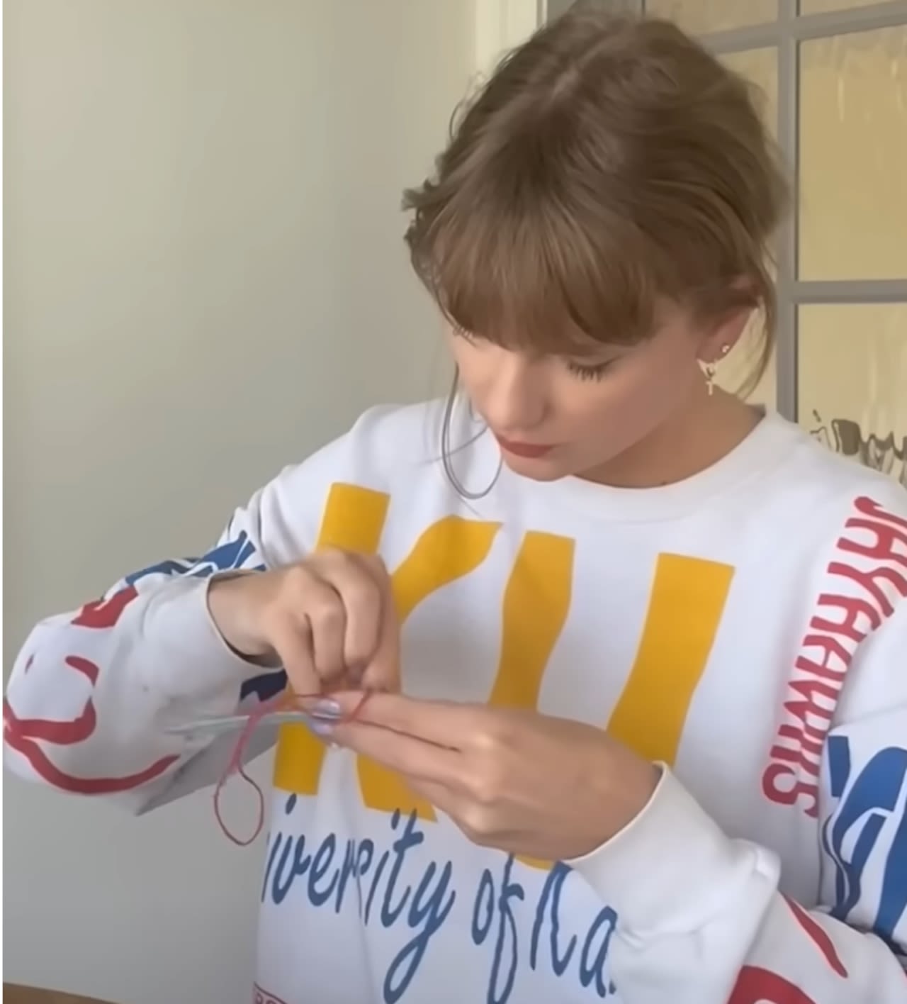 Where to buy the retro Kansas Jayhawks sweatshirt Taylor Swift wore in Fortnight Challenge video