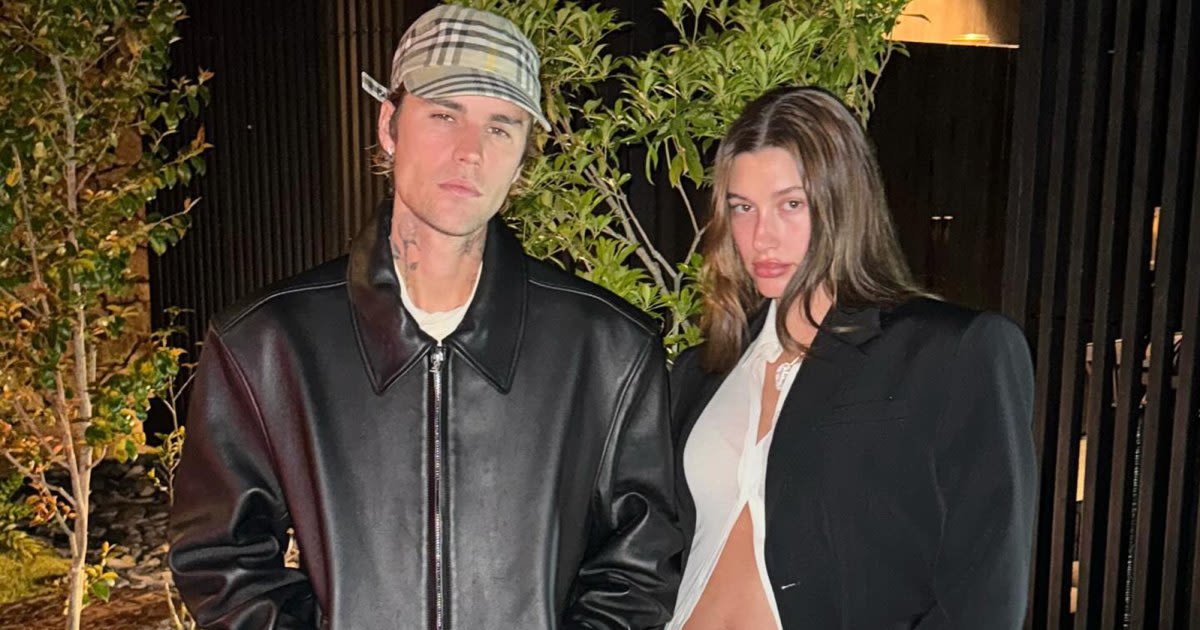 Justin Bieber Kisses Pregnant Wife Hailey While Holding Baby Bump