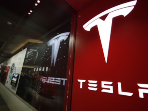 Tesla reports profit drop on price cuts, lower vehicle sales - The Economic Times