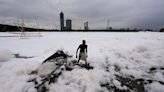 Toxic foam coats sacred river near New Delhi as Indian capital battles hazardous pollution