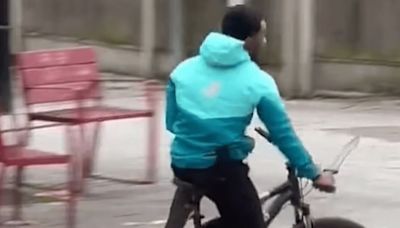 Watch moment cyclist brandishes huge knife in broad daylight on busy street