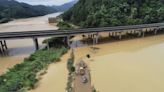 Southern China faces heavy floods, and landslides kill at least 9