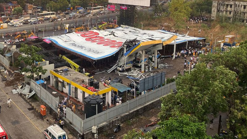 Four dead, several feared trapped as billboard falls over during Mumbai rainstorm | CNN