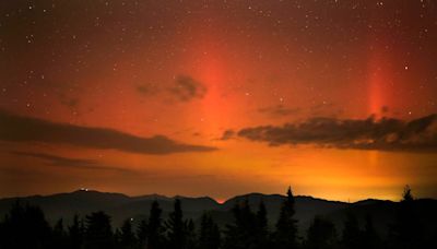 Stargazers share ‘wild’ images of northern lights seen over UK, US and Russian skies