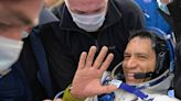 A US astronaut involuntarily set a record for time spent in orbit, after his mission home was aborted and added 6 months to his trip