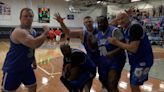 Former Detroit Lions players take on Lansing Firefighters in charity basketball game