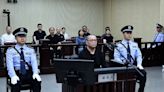 Chinese court sentences former banker to death for bribery