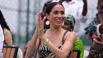 Meghan Markle's diamond cross necklace, allegedly from Princess Diana's collection, under scrutiny after Nigeria visit