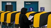 California voters cast ballots on a wet election day: 'I'm doing my part'