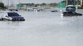 A storm dumps record rain across the desert nation of UAE and floods the Dubai airport