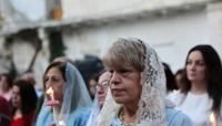 Palestinian Orthodox Christians attend Easter mass outside the church of Saint Porphyrius in Gaza City