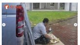 Photo of migrant worker having a meal in the middle of the road, under the pouring rain, triggers concerns