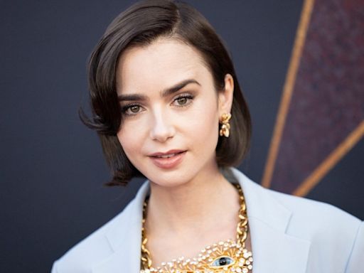 Lily Collins shows off dramatic hair transformation in bold sky blue blazer and draped skirt combo