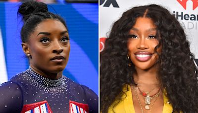 SZA shows off gymnastics skills in a friendly handstand contest with Simone Biles