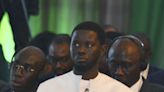 Senegal's leader wasn't born when ECOWAS was founded. He's asked to reunite the bloc split by coups